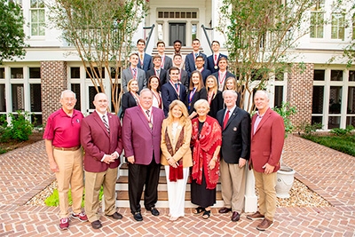 Photo of James and Martha Seneff with group at celebratory event