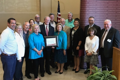 Group photo of President Thrasher and alumni