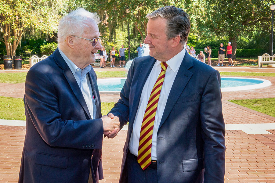 Charles Rockwood and Richard McCullough shaking hands