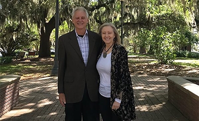 Photo of Laurie and Kelly Dozier standing next to each other and smiling in LeMoyne Park