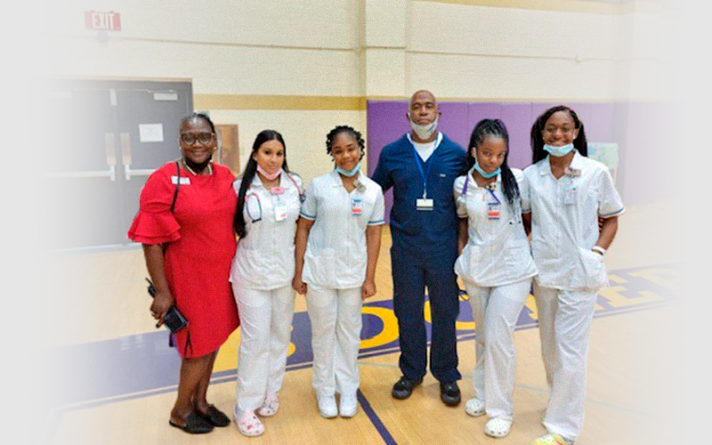 Dr Shelly and students smiling