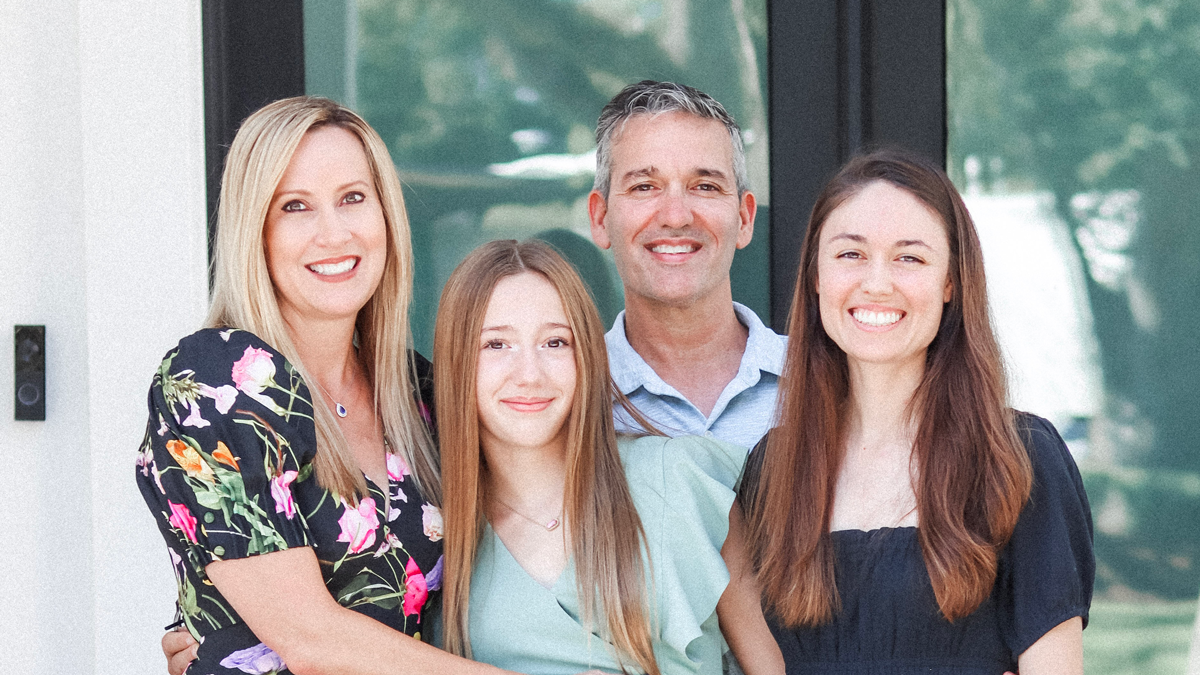 A family photo of Tony DiBenedetto, his wife, and their two daughters.