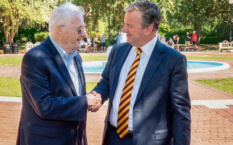 Charles Rockwood and Richard McCullough shaking hands