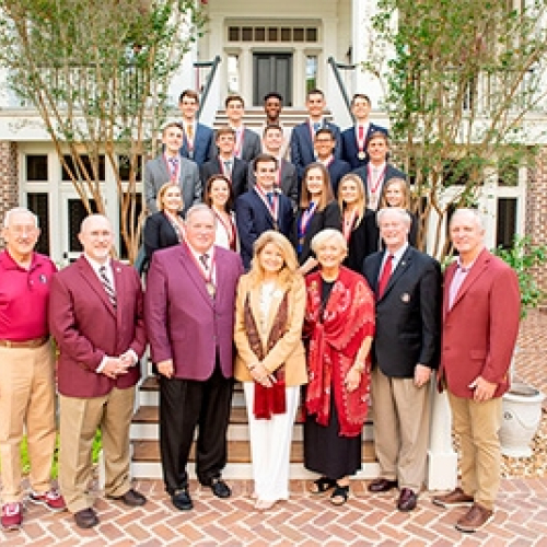 Photo of James and Martha Seneff with group at celebratory event