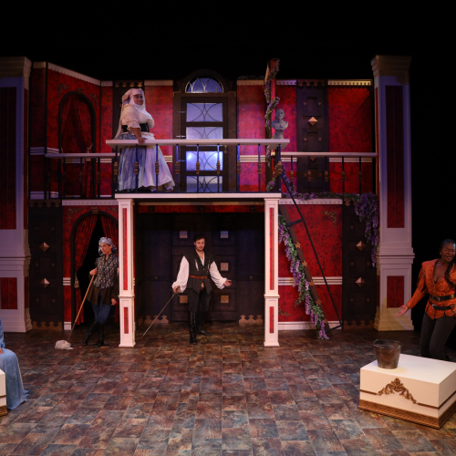 Image of actors on a stage performing Romeo and Juliet