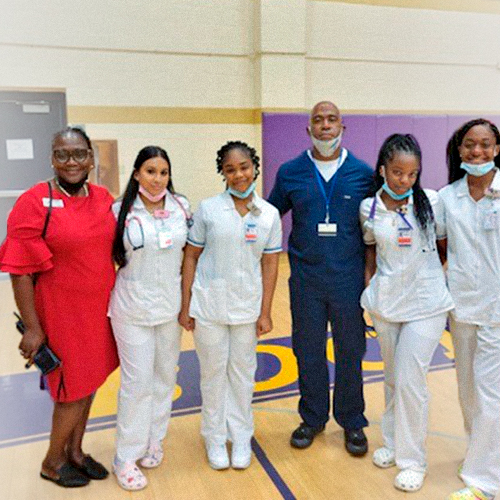 Dr Shelly and students smiling