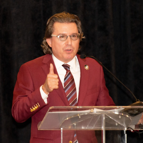 A man at a podium speaking to a crowd